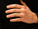 Gold diamond ring on a man's finger, jewelry