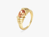 Gold ring with oval peach gemstone, jewelry design