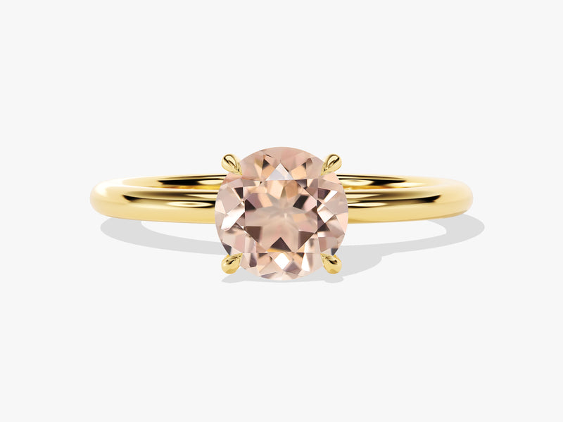 Oval morganite engagement ring in yellow gold setting