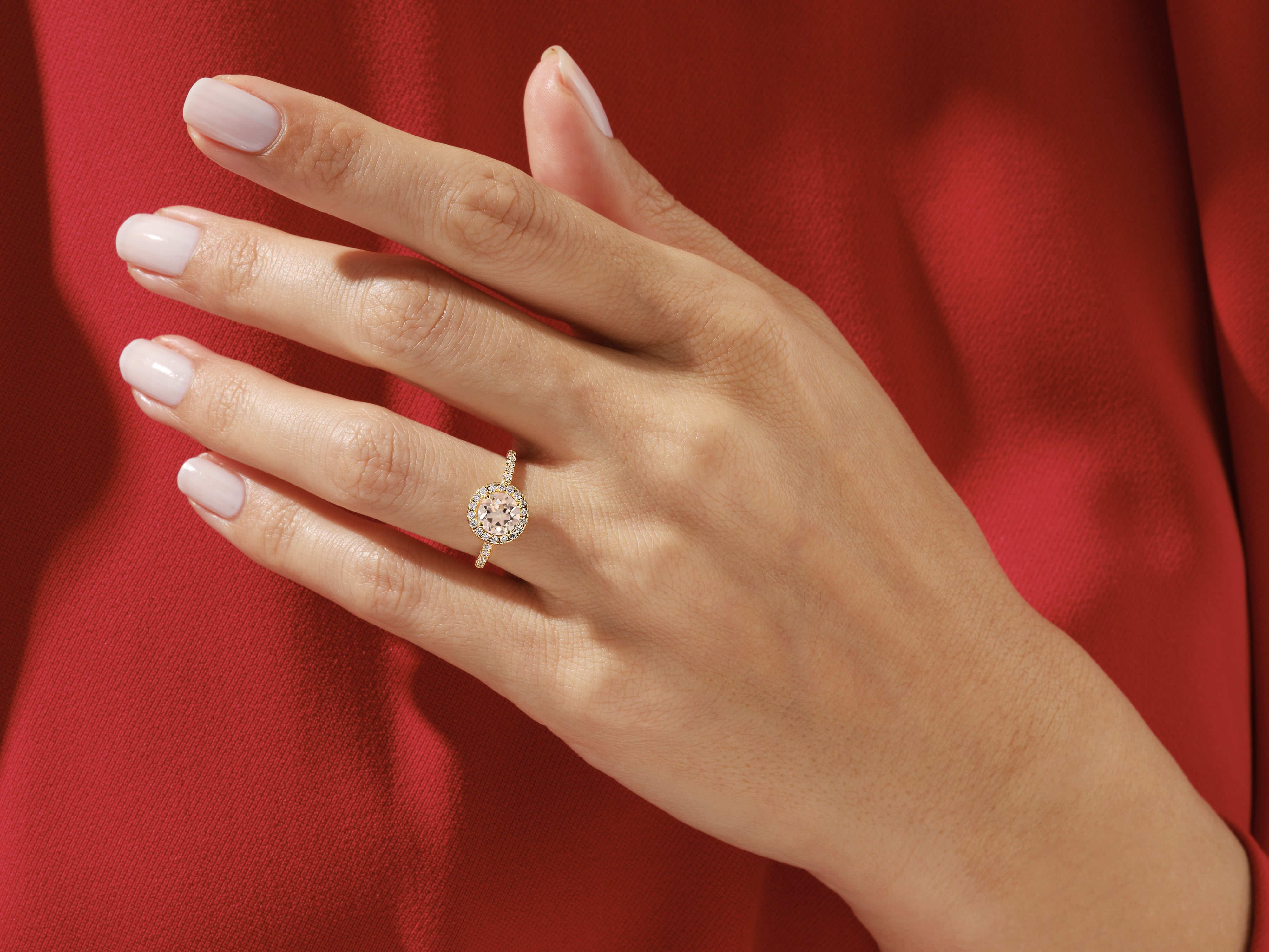 Diamond halo engagement ring on a woman's hand