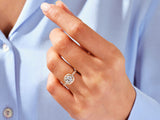 Diamond halo engagement ring on a woman's hand
