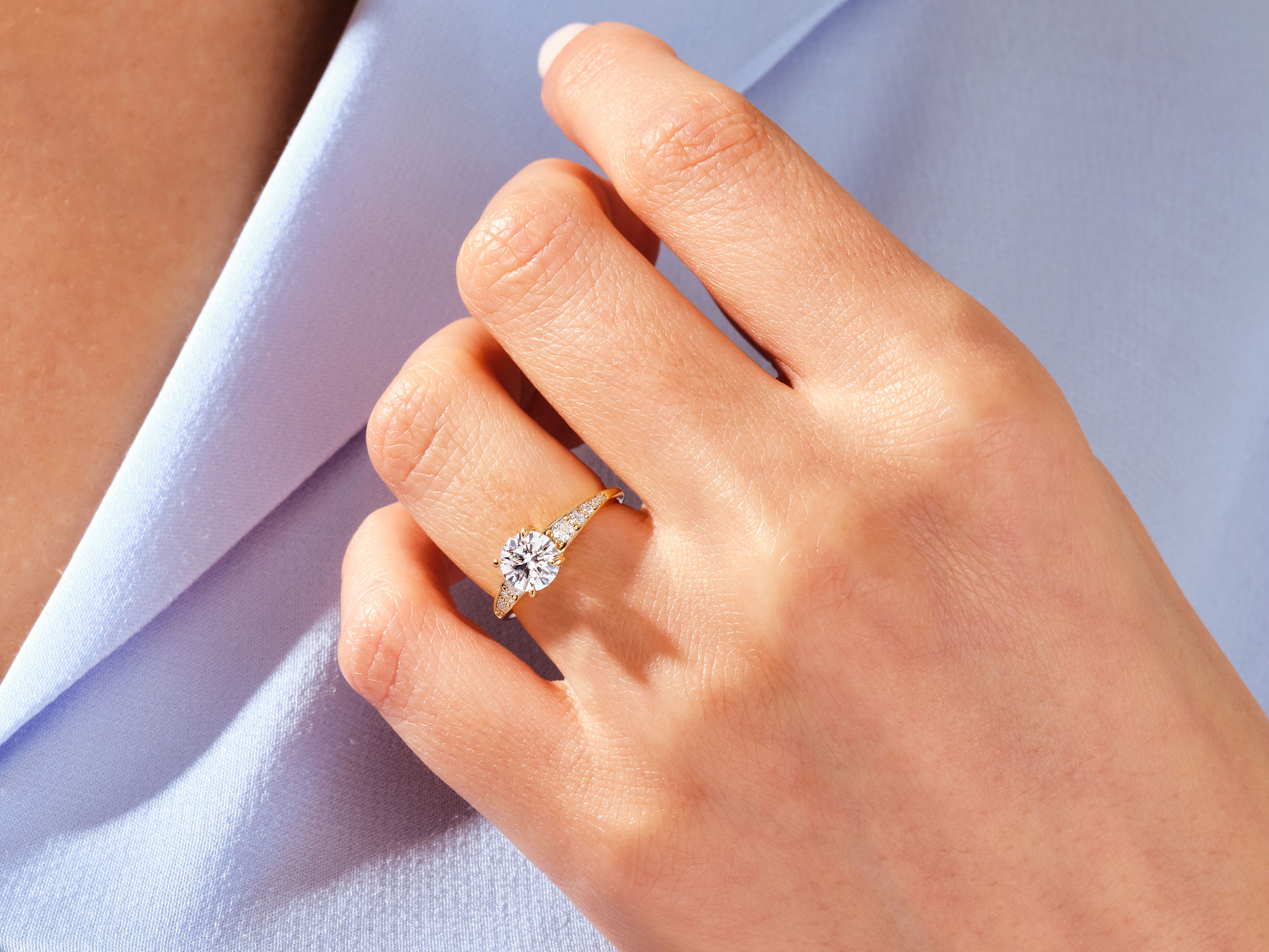 Diamond engagement ring on a woman's hand, jewelry