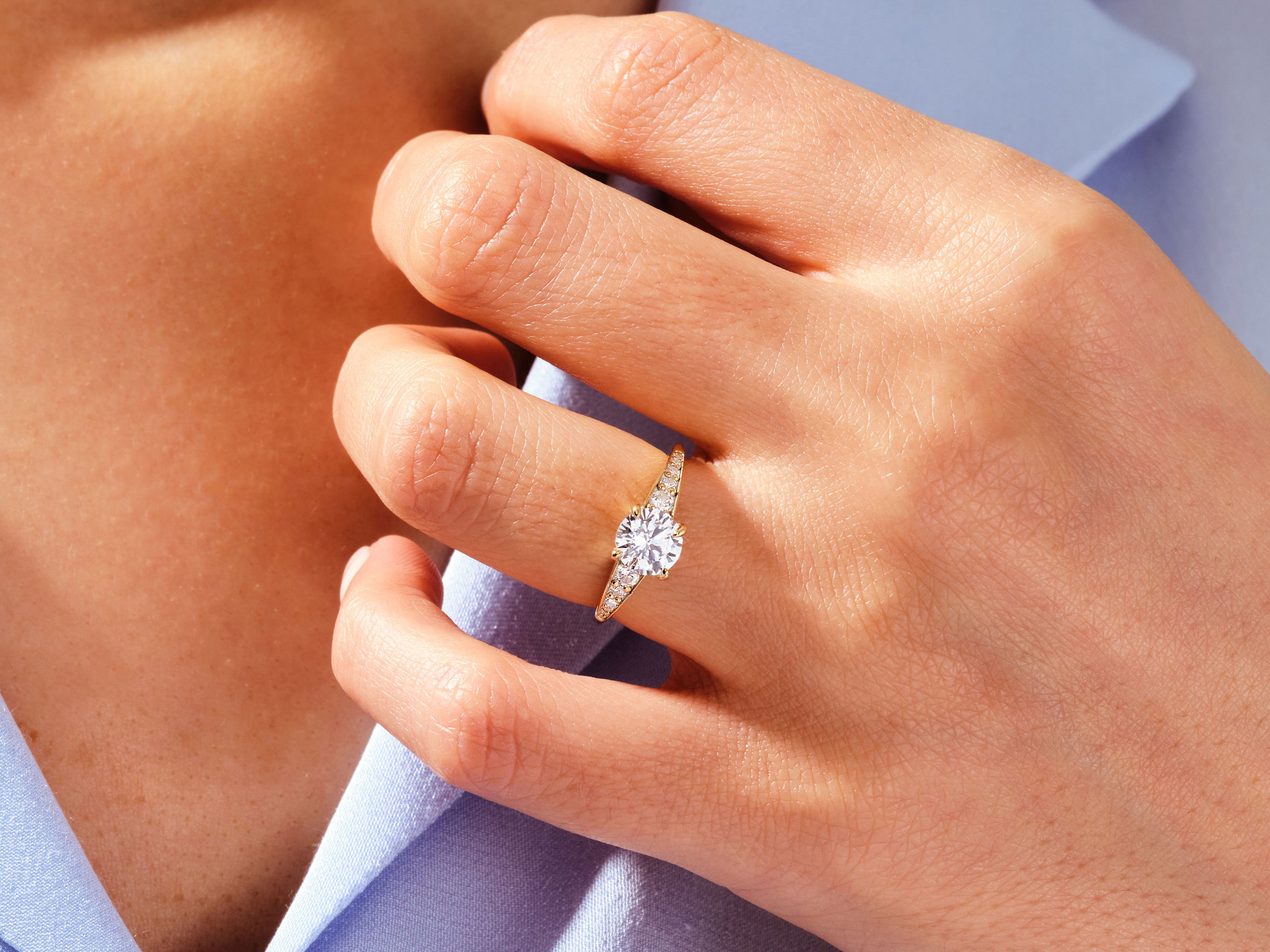 Diamond engagement ring on a woman's hand, jewelry photography