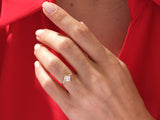 Gold princess cut diamond ring on hand