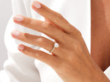 Gold heart diamond ring on a woman's hand