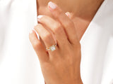 Diamond halo engagement ring on a woman's hand