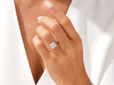Princess cut diamond engagement ring with halo on hand
