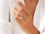 Diamond halo engagement ring on a woman's hand