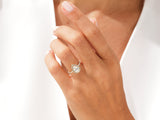 Pear-shaped diamond engagement ring with halo, gold band