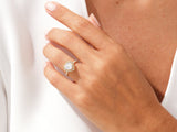 Heart-shaped diamond engagement ring on a woman's hand