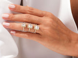 Three diamond halo rings on a hand, jewelry photography