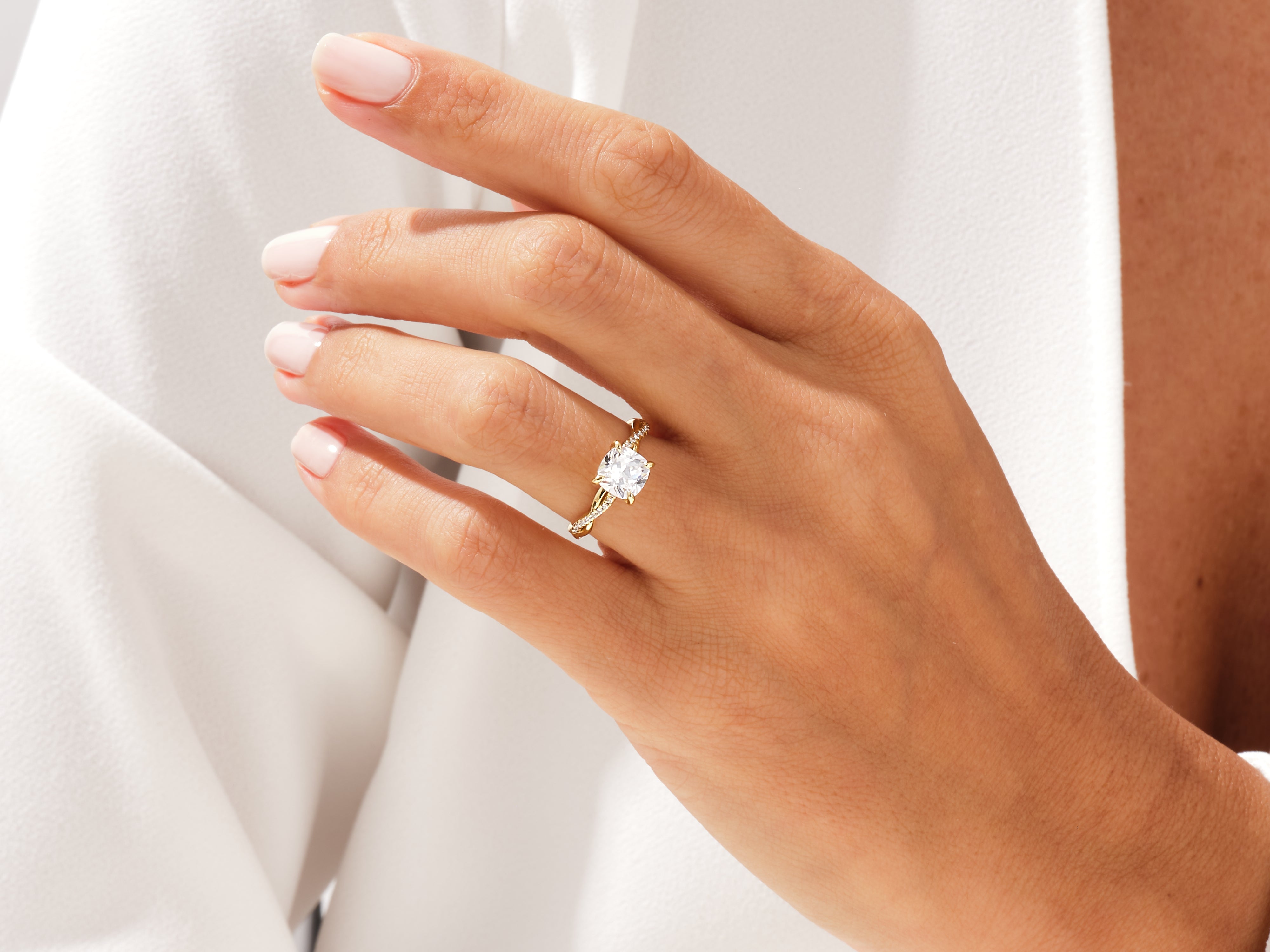 Gold diamond ring on a woman's hand, elegant jewelry for her
