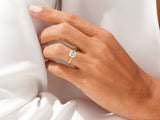 Elegant square diamond engagement ring on a hand