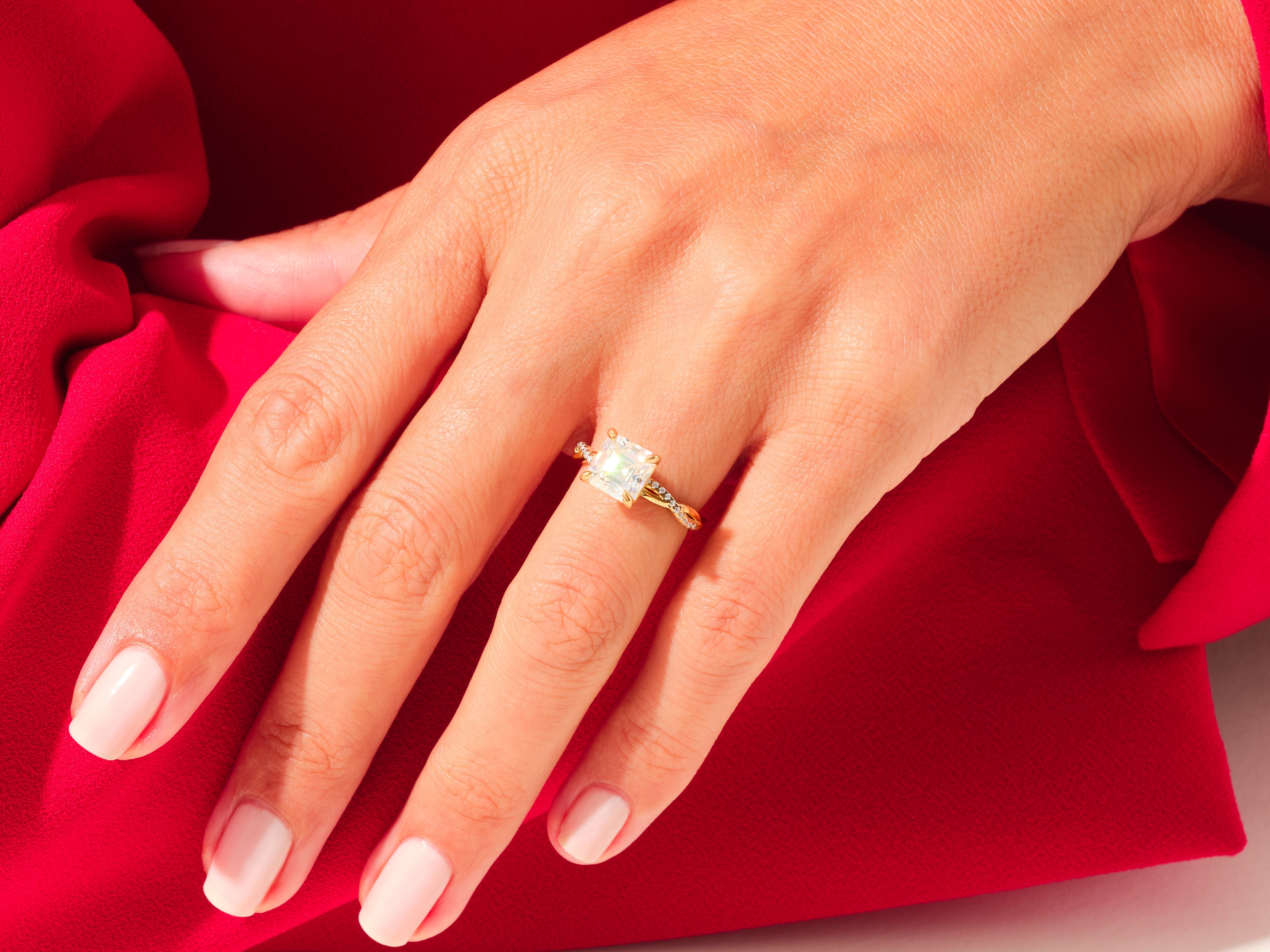 Diamond engagement ring on a hand, luxury jewelry for her