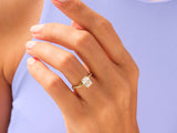 Gold ring with princess cut diamond on hand