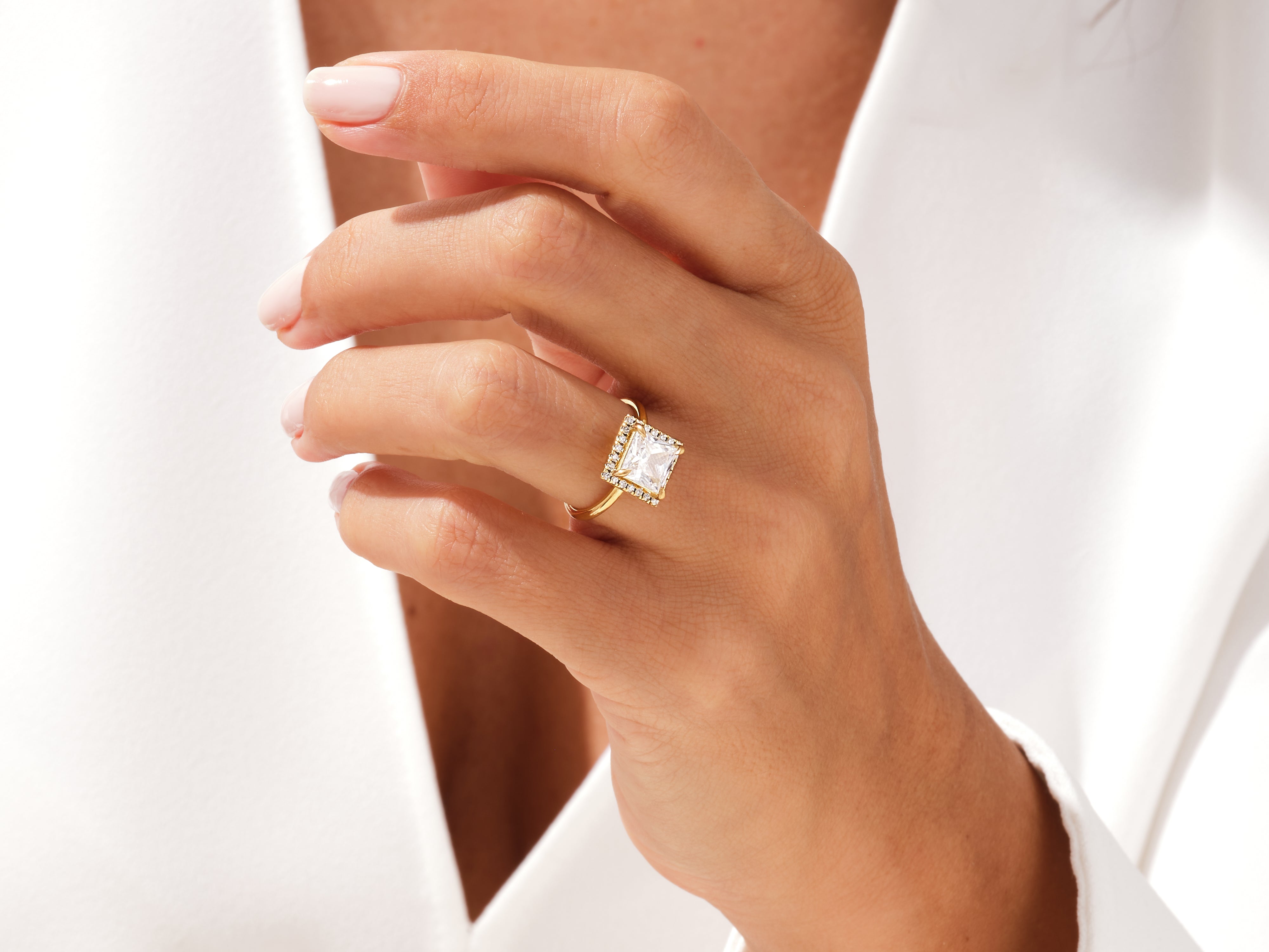 Gold ring with square diamond and halo, jewelry