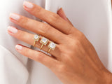 Three diamond halo square rings on a woman's hand