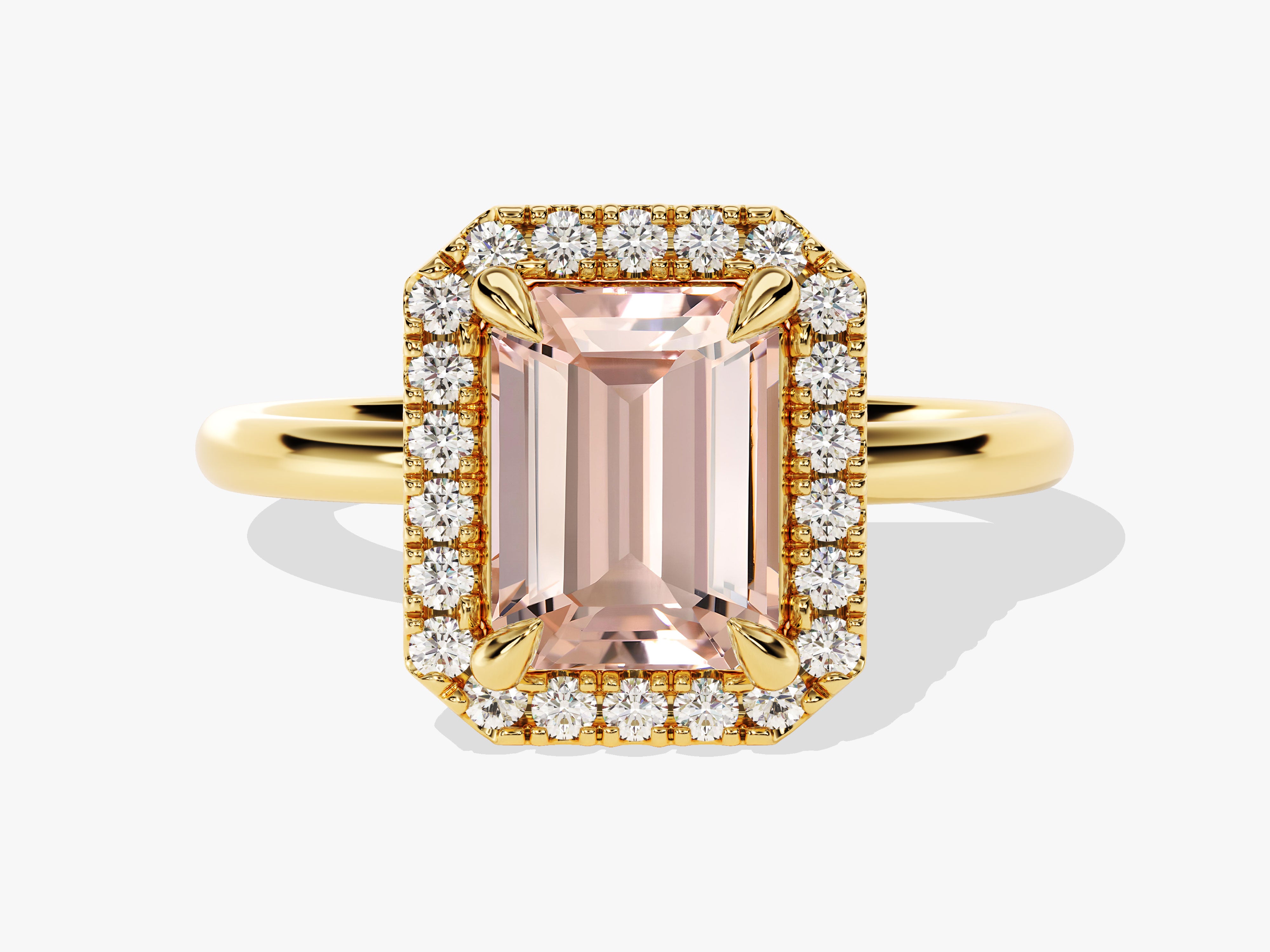 Emerald cut pink gemstone ring with diamond halo and gold band