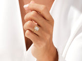 Gold ring with emerald cut diamond and halo diamonds