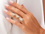 Gold marquise diamond rings with halo on hand