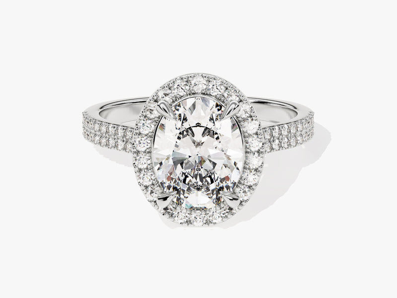 Oval diamond halo engagement ring with pave band