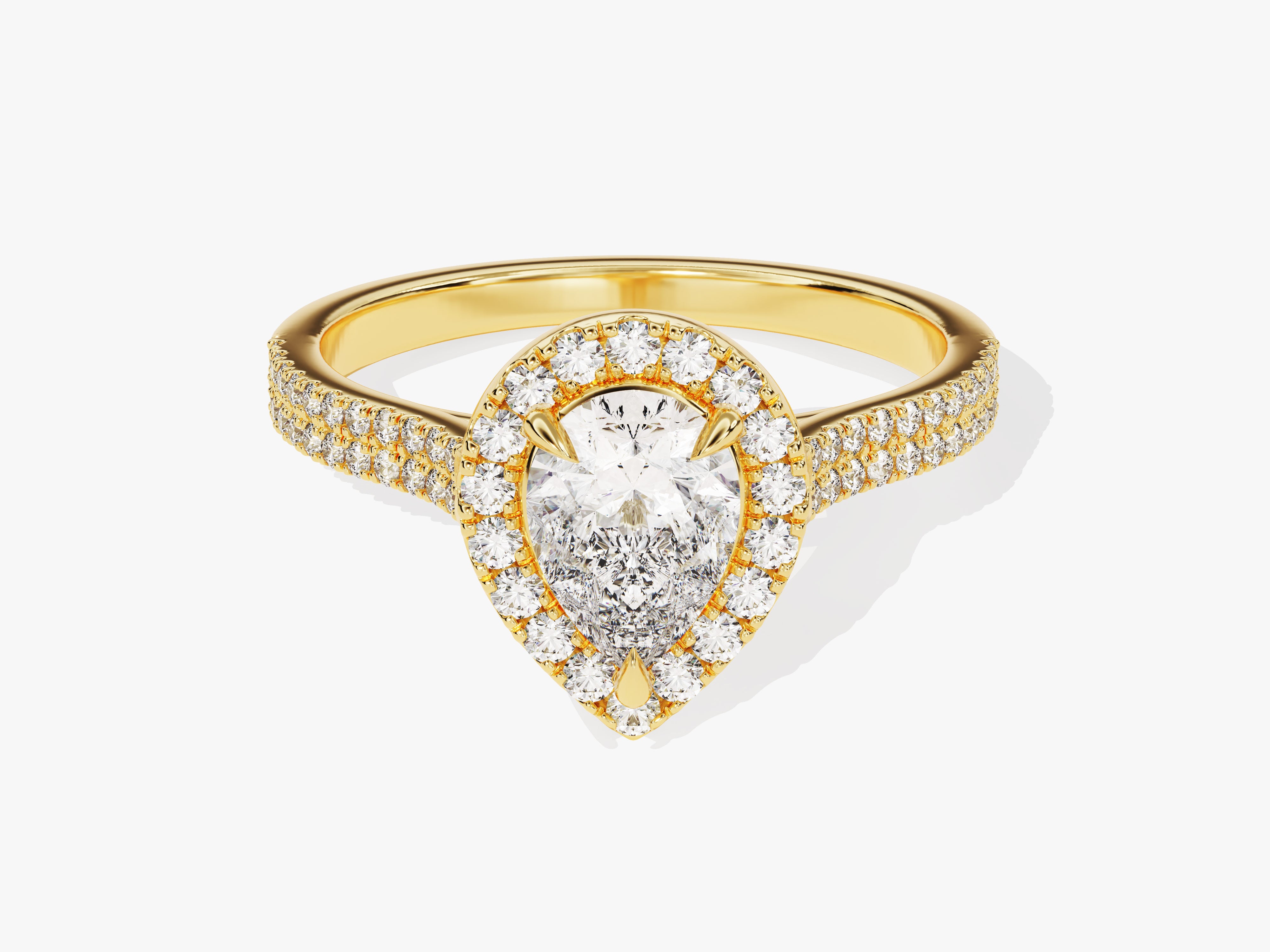Gold pear-cut diamond engagement ring with halo and pave band