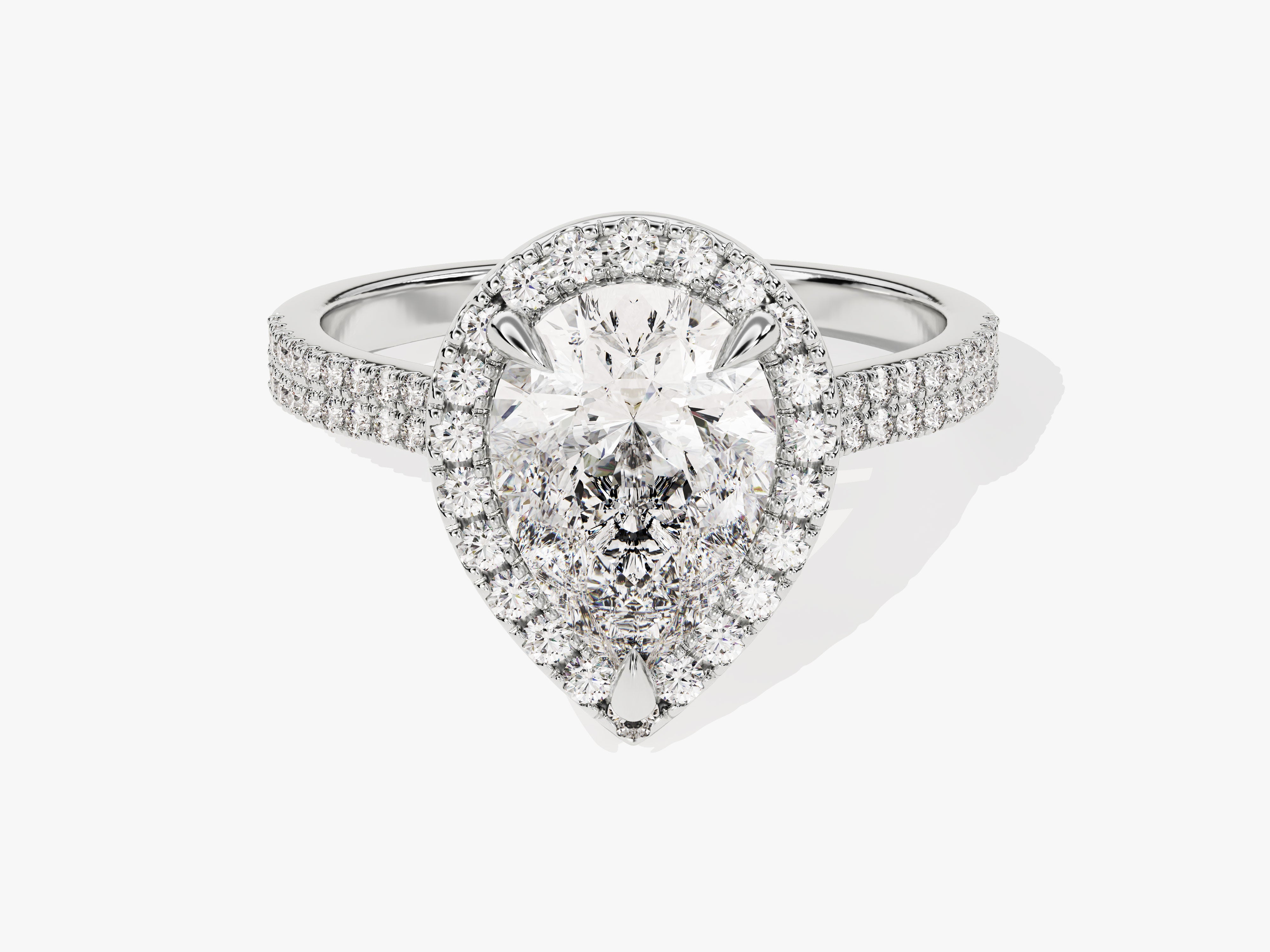 Diamond engagement ring with pear-shaped center stone and halo