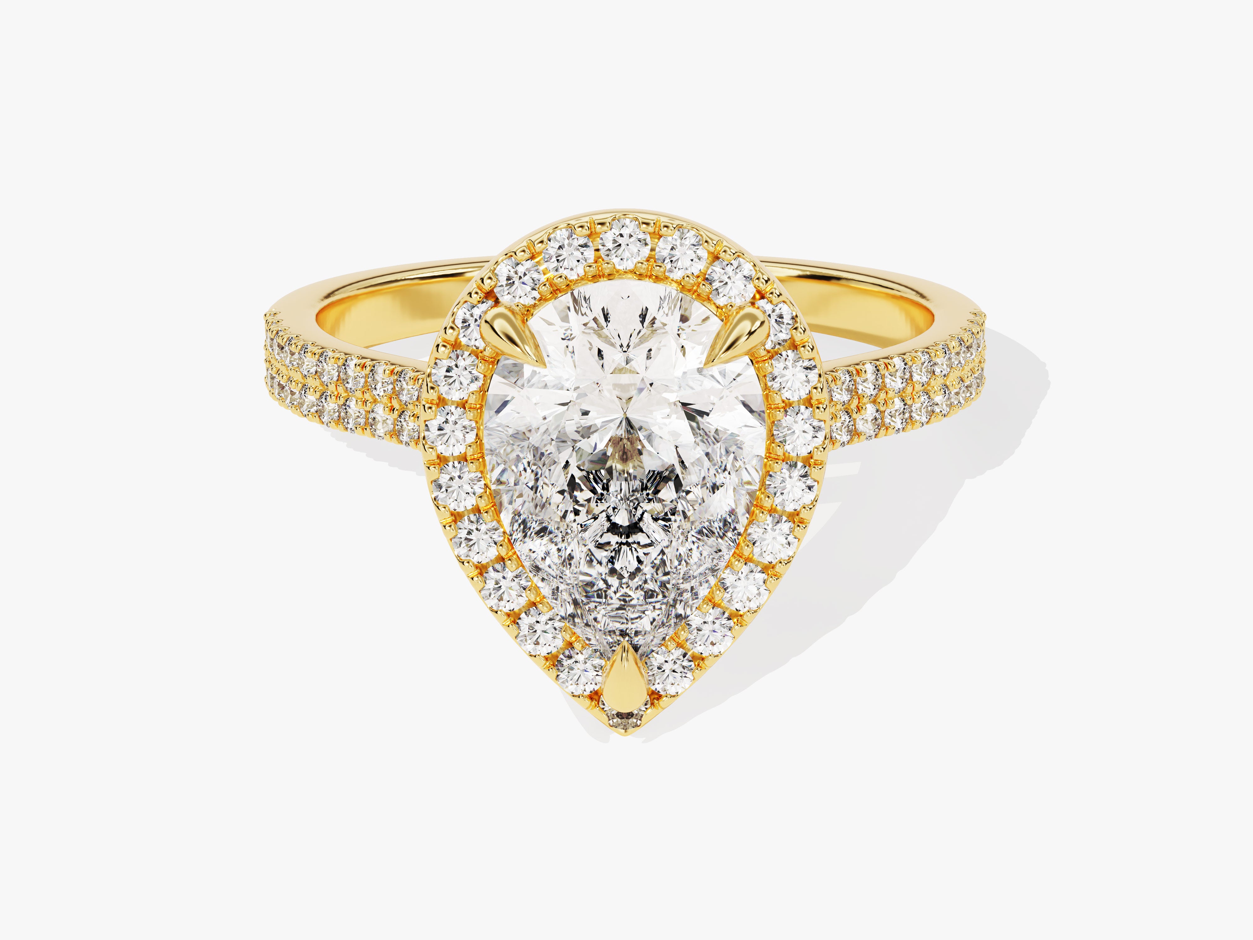 Gold pear-shaped diamond halo engagement ring with pave band