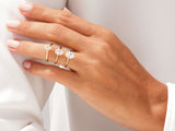 Gold oval diamond rings on a hand, fine jewelry collection