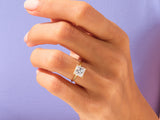 Princess cut diamond engagement ring on a woman's hand