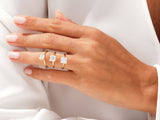 Gold princess cut diamond rings on a hand