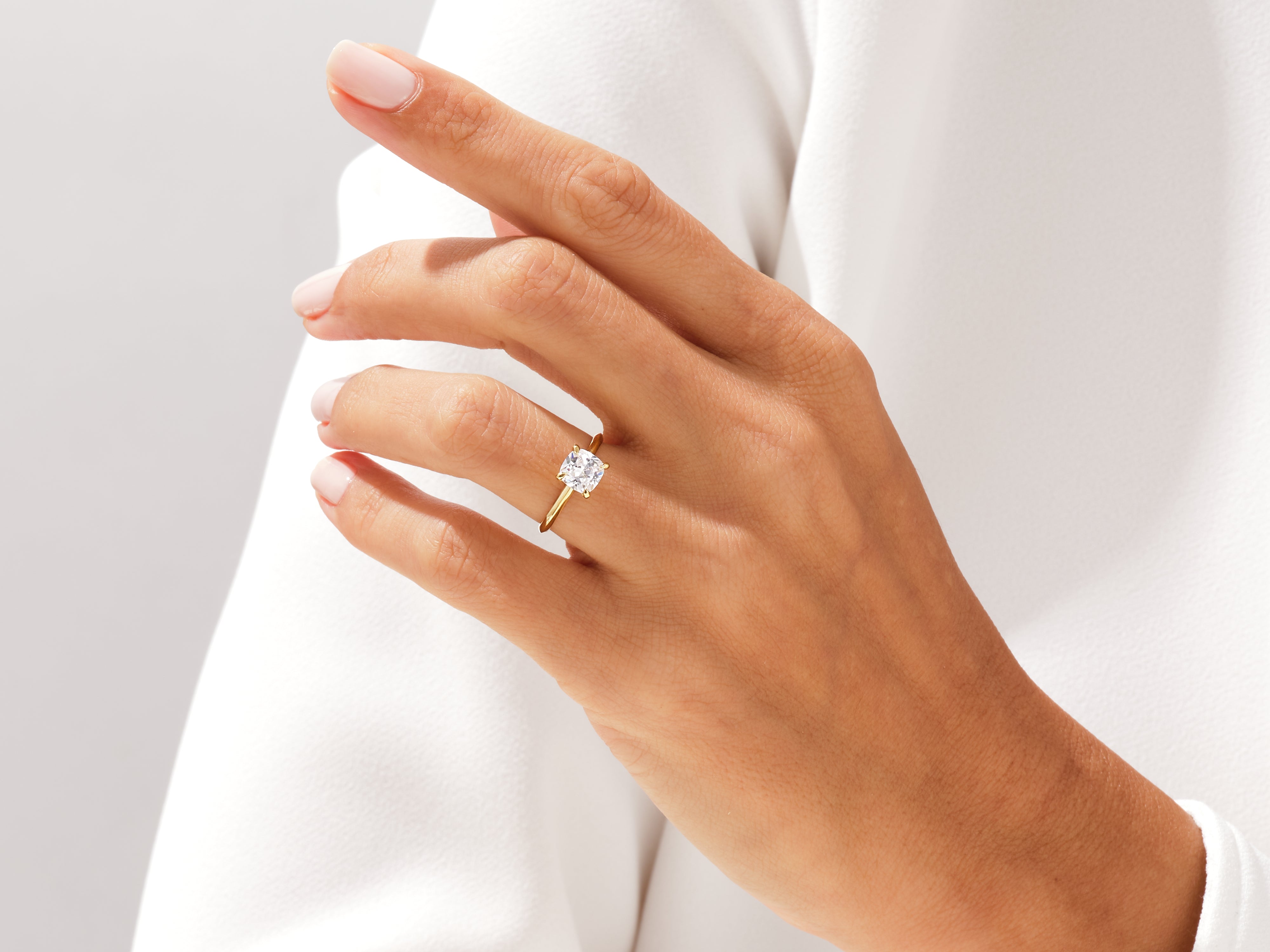 Gold diamond ring on a woman's finger, jewelry