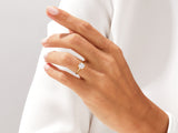 Gold diamond ring on a woman's finger, jewelry