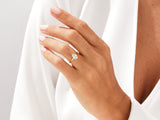 Pear-shaped diamond engagement ring on a woman's hand