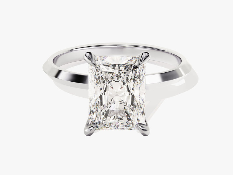 Radiant cut diamond engagement ring on white background