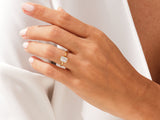 Gold ring with emerald cut diamond on hand