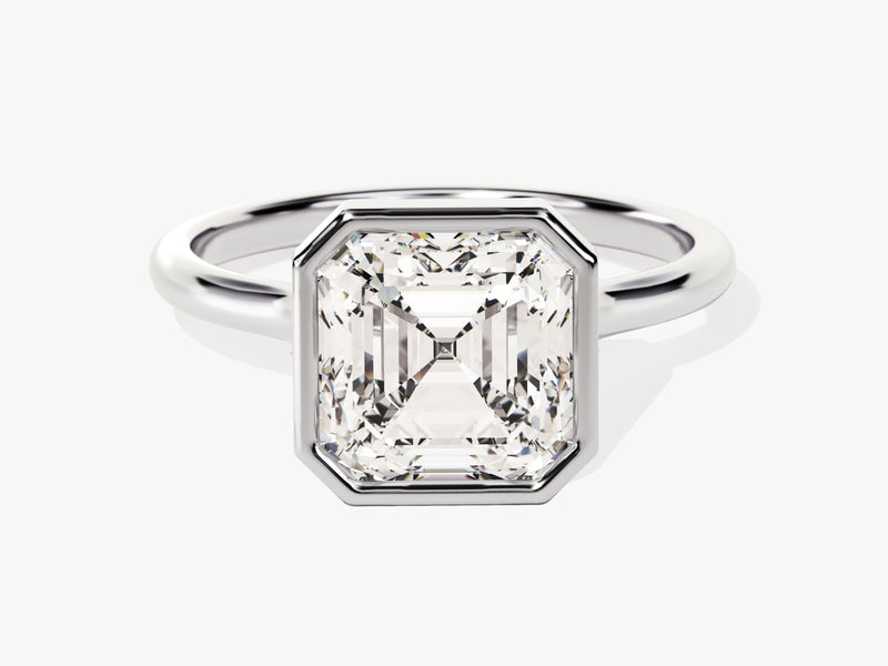 Emerald cut diamond ring in platinum bezel setting
