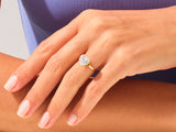 Heart-shaped diamond ring on a woman's finger, fine jewelry