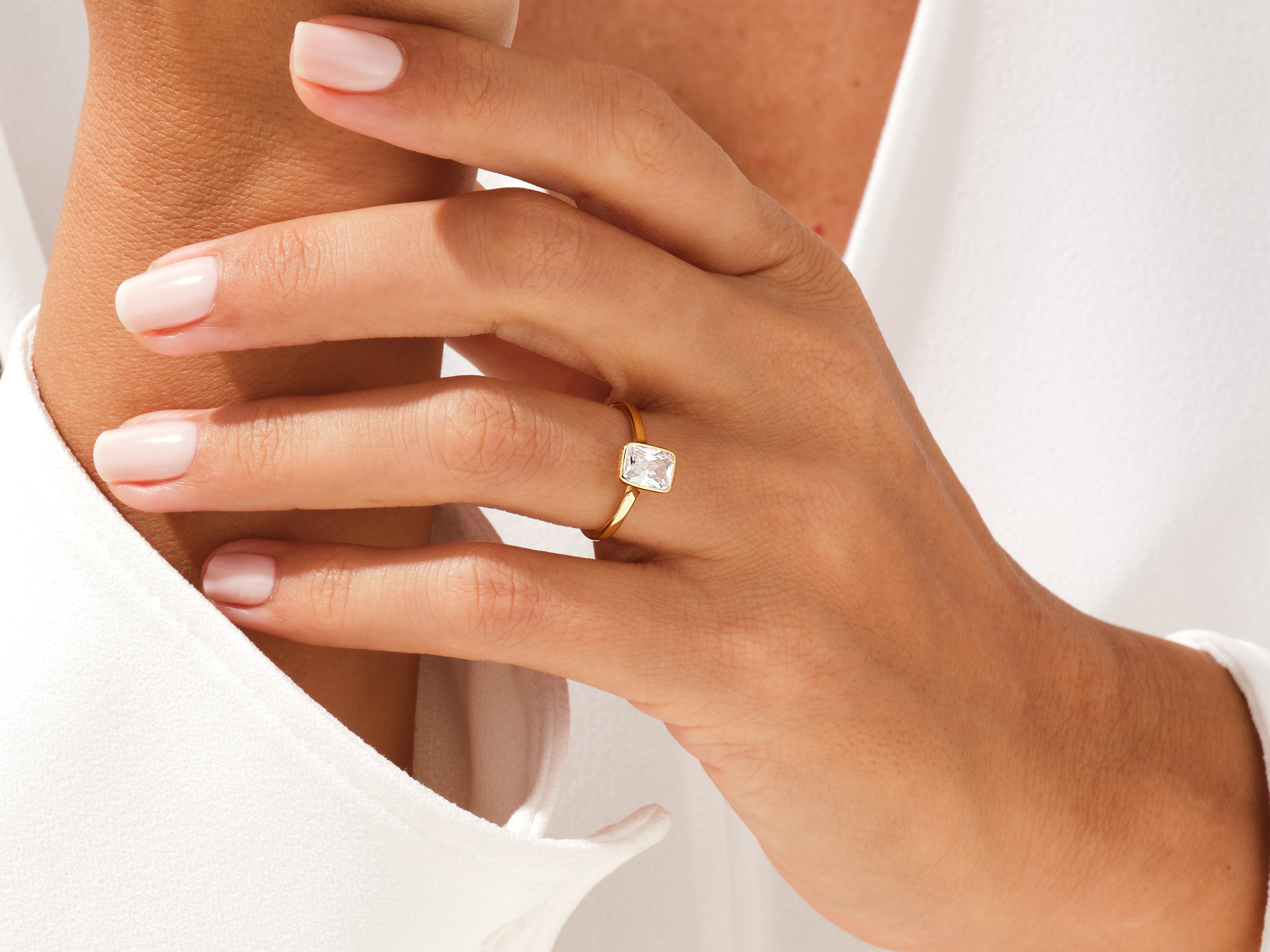 Gold ring with emerald-cut diamond, elegant jewelry for her
