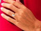 Gold ring with emerald cut diamond on hand