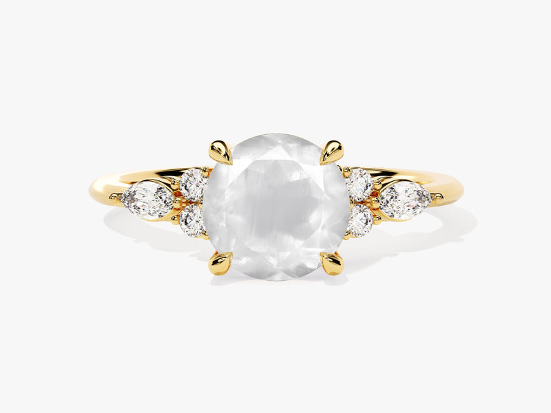 Oval moonstone ring with diamonds on a gold band