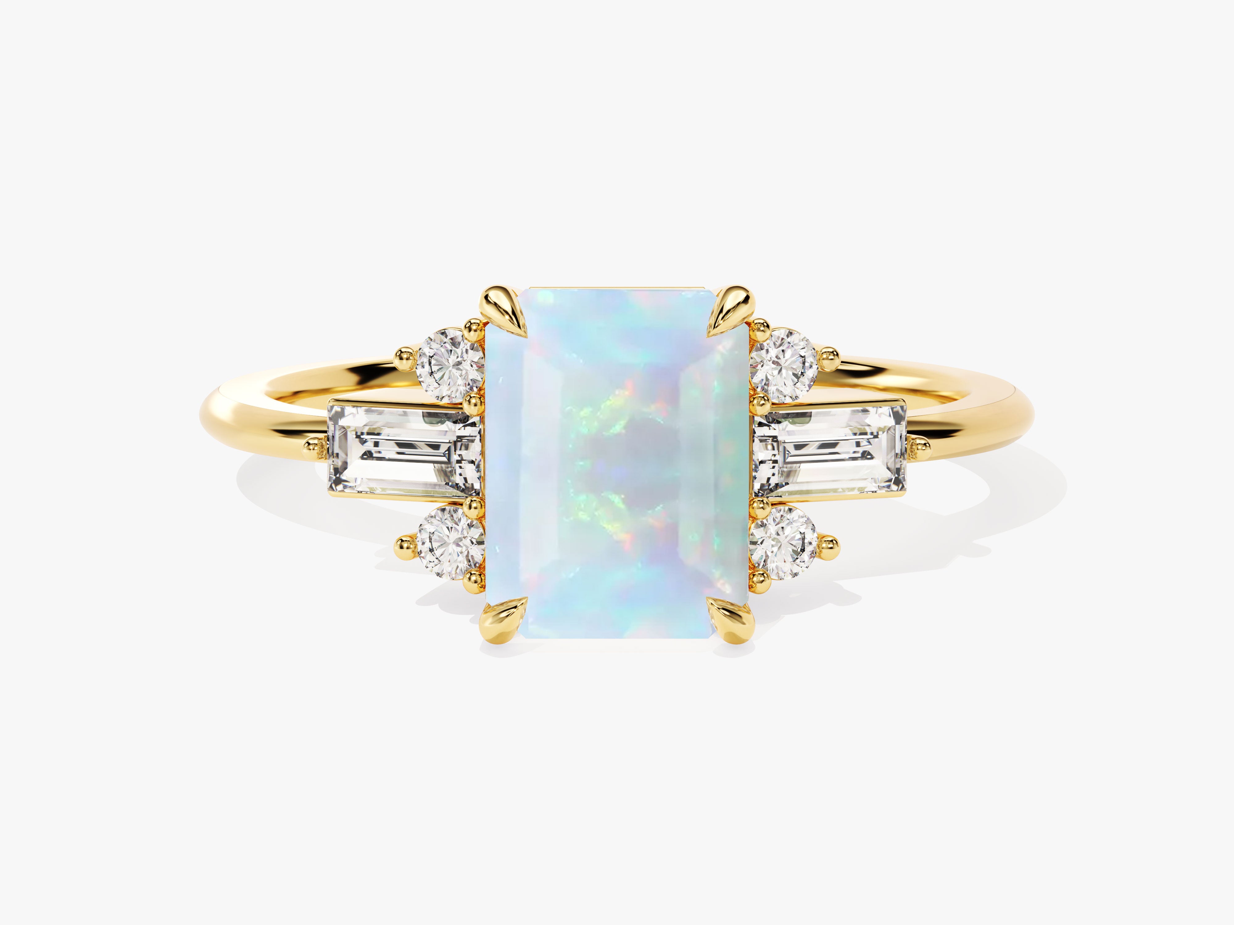Gold ring with emerald-cut opal and baguette diamonds
