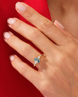 Gold ring with moss agate and diamonds on a hand