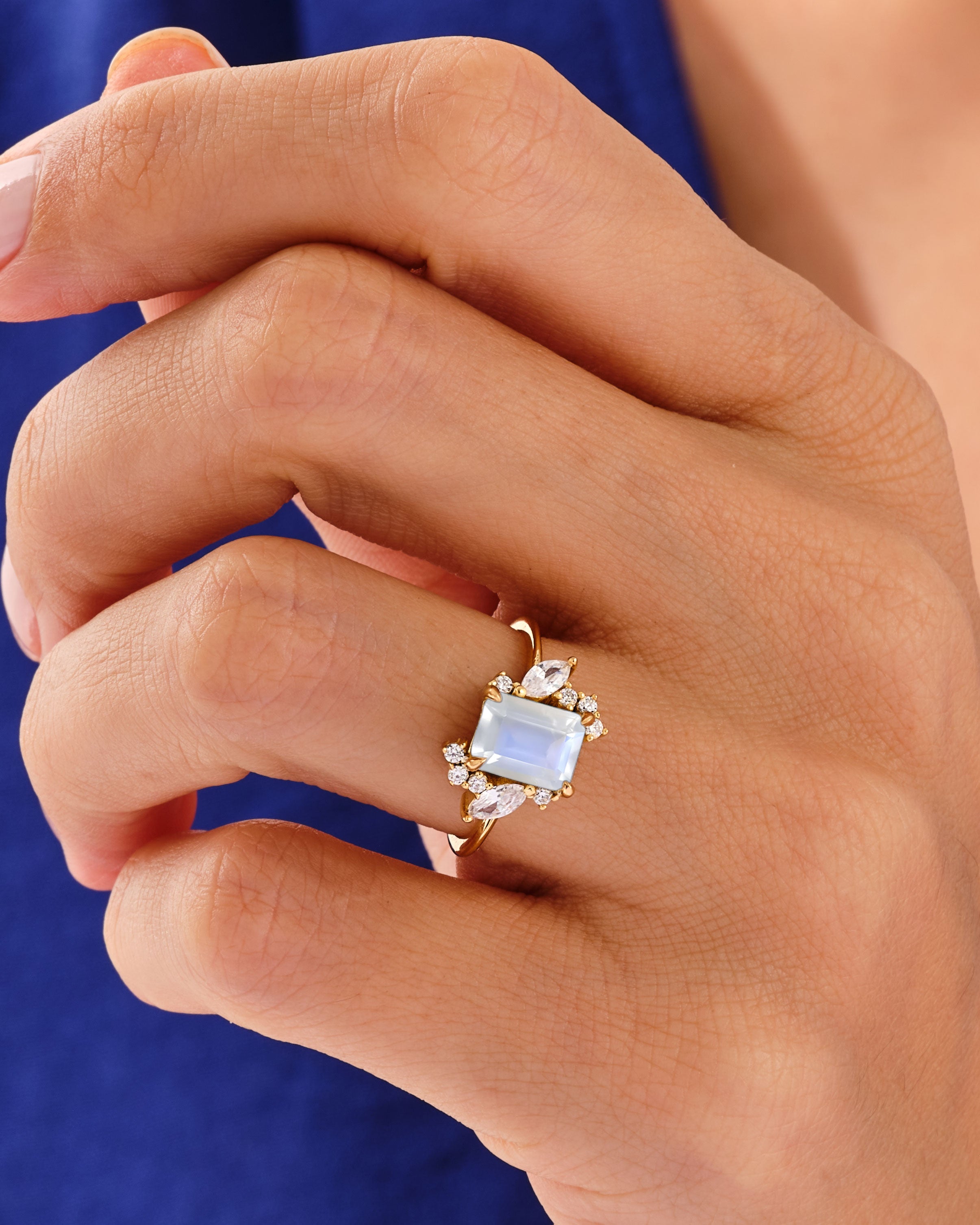 Emerald Cut Moonstone Engagement Ring with Marquise and Round Moissanite Sidestones