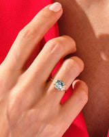 Gold ring with moss agate and diamonds on a hand