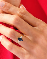 Marquise sapphire and diamond ring on hand