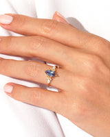 Marquise sapphire and diamond ring on a hand