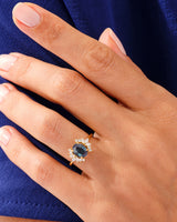 Oval alexandrite ring with diamonds on a hand