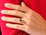 Oval sapphire and diamond ring on hand