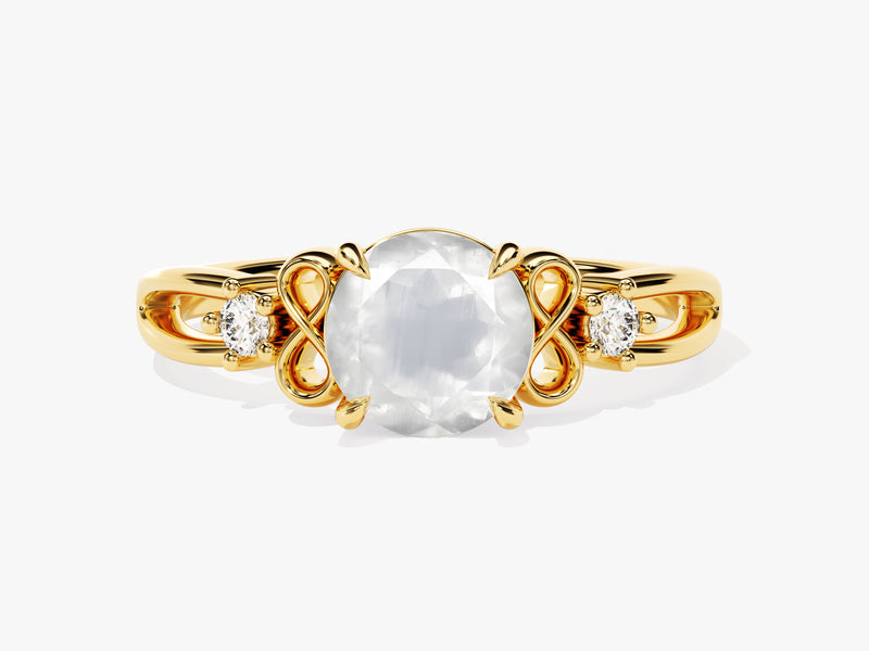 Gold ring with large clear gemstone and two small diamonds